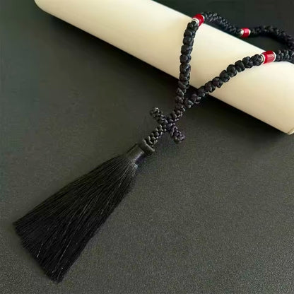 Tchotki orthodoxe grec authentique à 50 noeuds posé sur un parchemin 